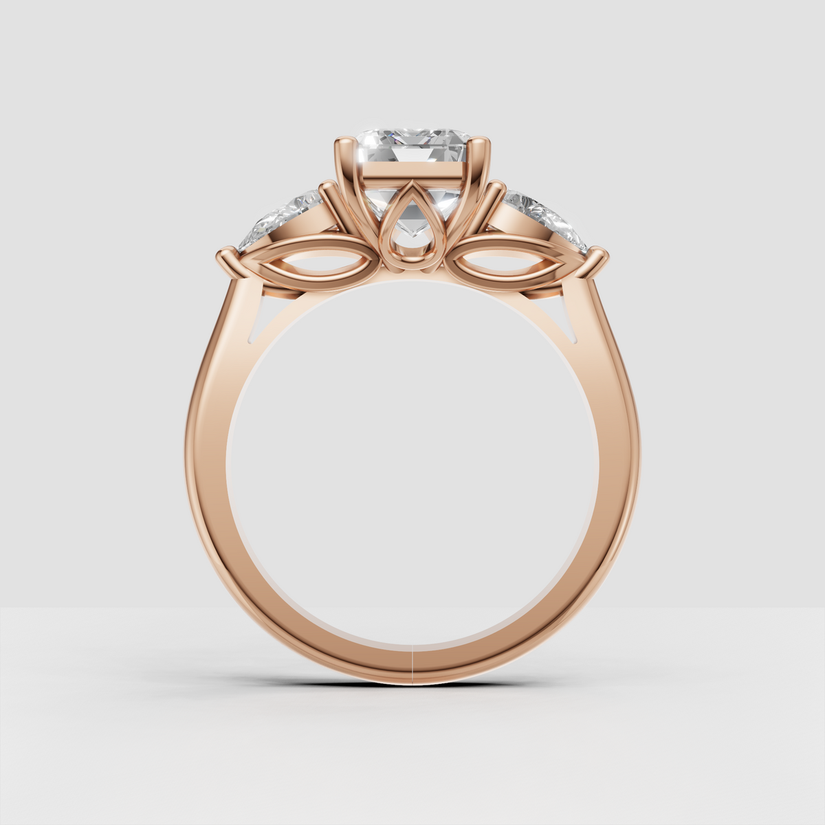 Prong set emerald cut three stone ring