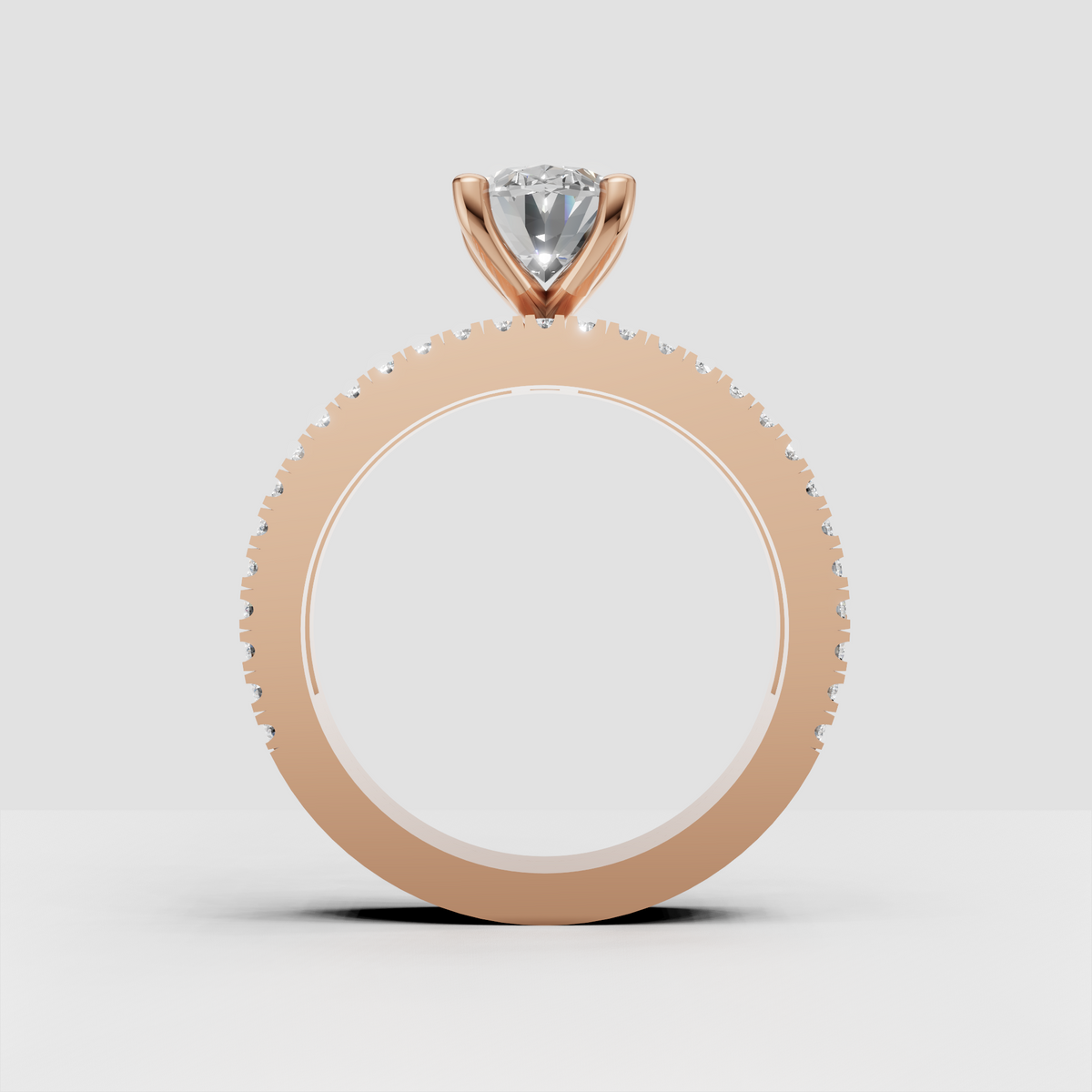 Contemporary oval diamond engagement ring with detailed baguette and round stone band