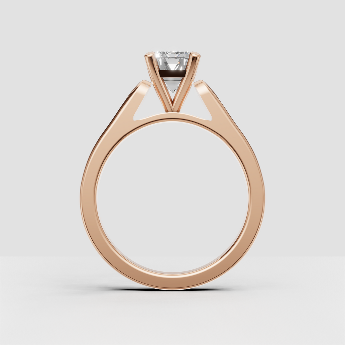 Elegant yellow gold engagement ring featuring an elongated step-cut center.
