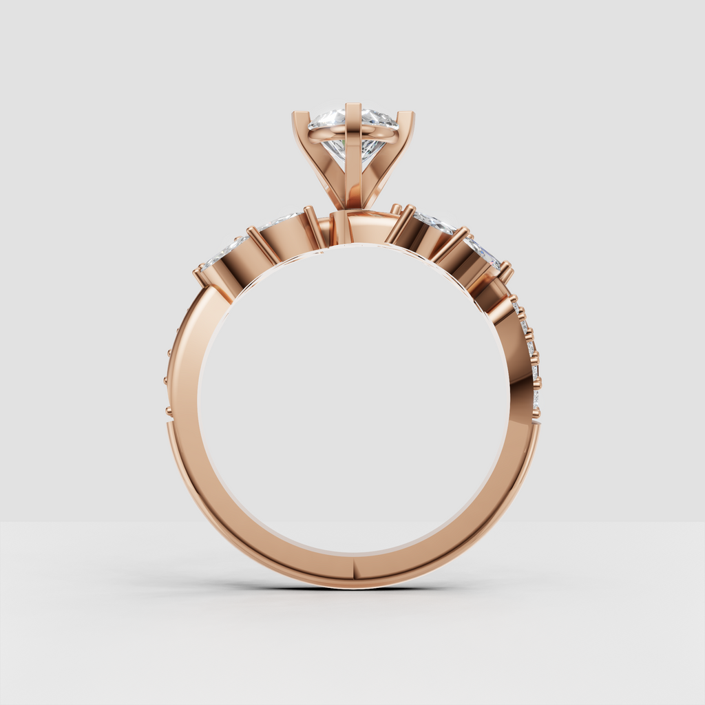 Pear diamond ring with sculpted gold leaves and accent stones