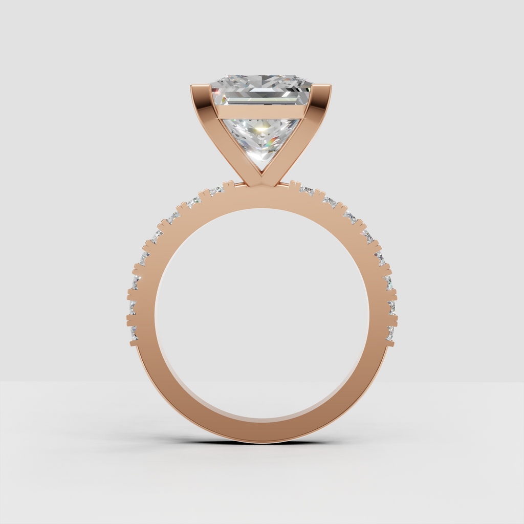 Princess cut engagement ring featuring a polished gold band