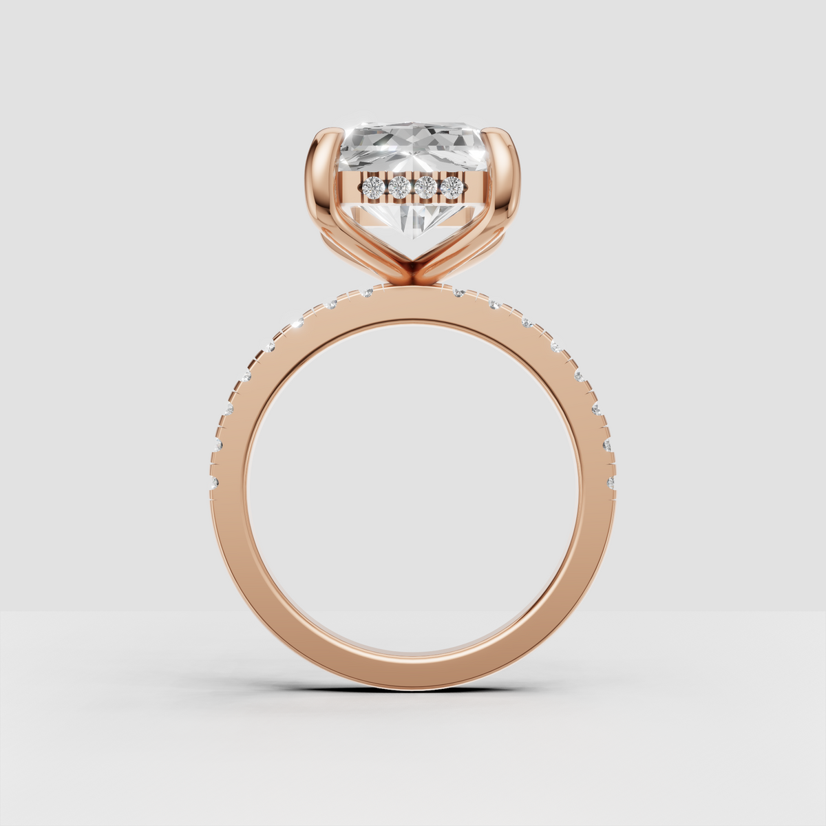 Yellow gold hidden halo Radiant Diamond ring with brilliant accent stones