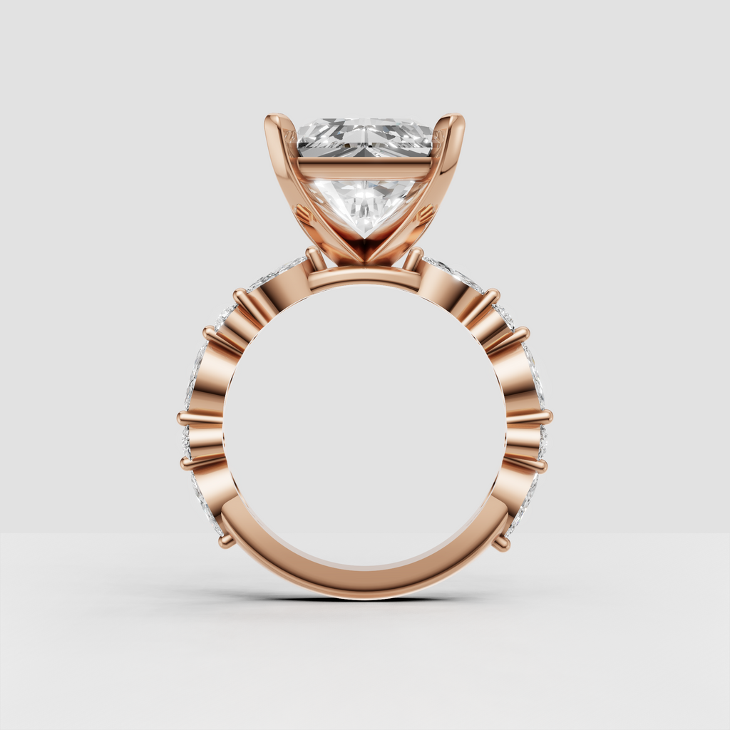 Elongated radiant diamond engagement ring with graduated shoulder diamonds