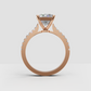 Yellow gold emerald engagement ring with delicate pavé diamonds