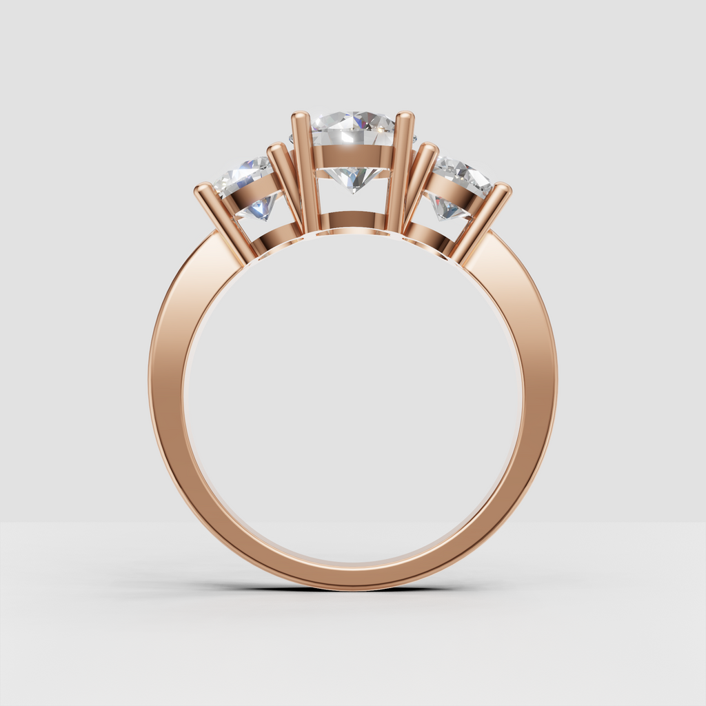 Classic yellow gold engagement ring with three round stones