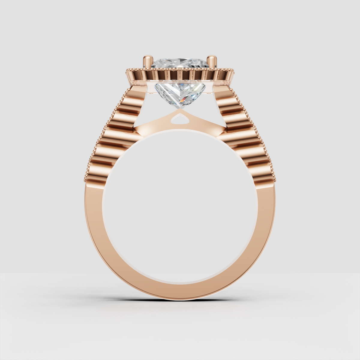 Halo diamond engagement ring featuring square canter stone and pave split band