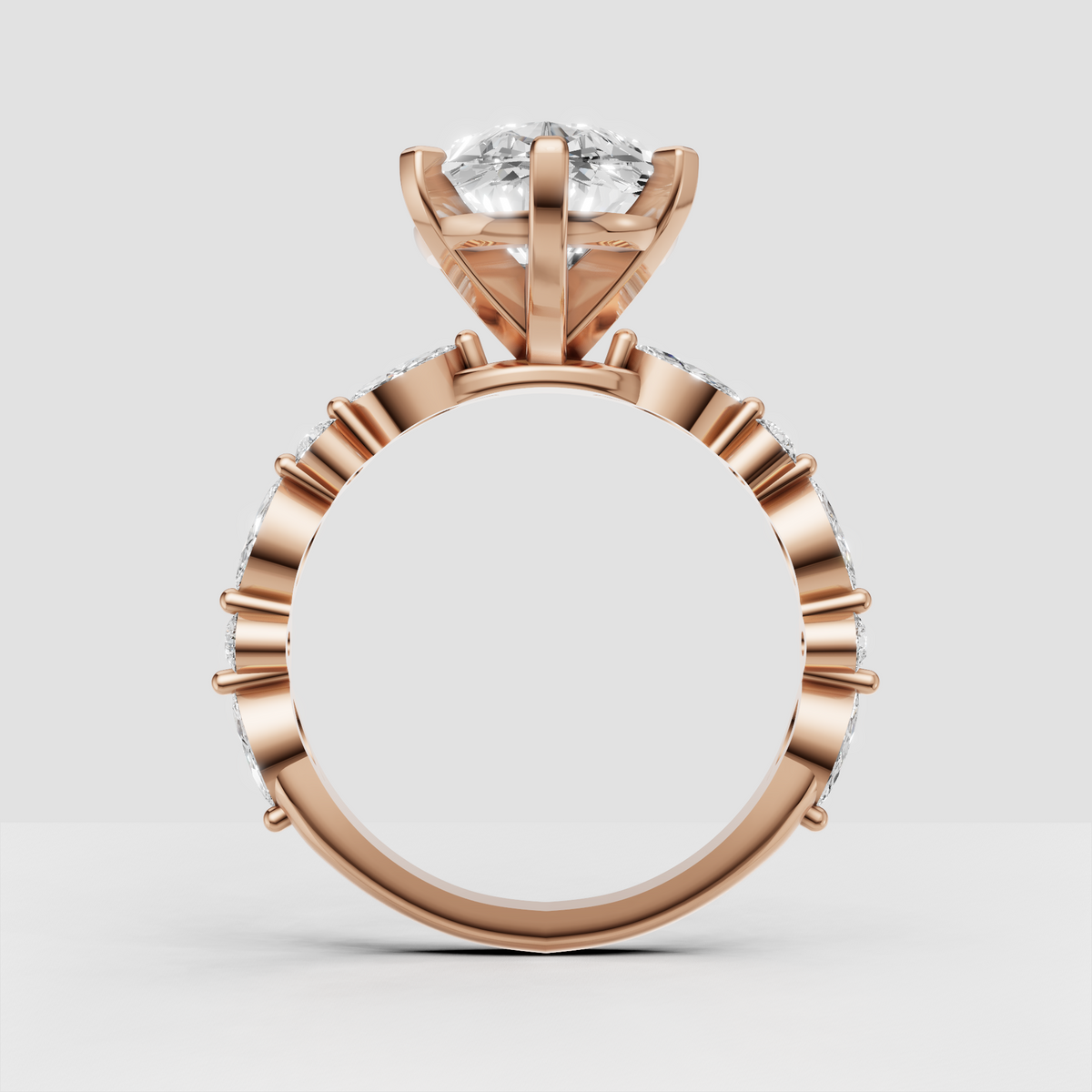 Pear-shaped engagement ring with multi-prong center setting