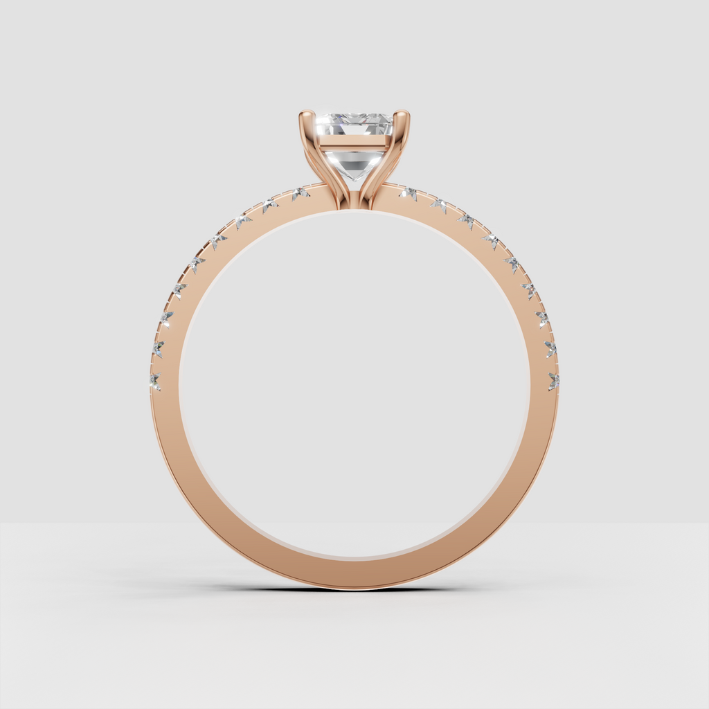 Sophisticated emerald cut diamond ring with polished metal shank