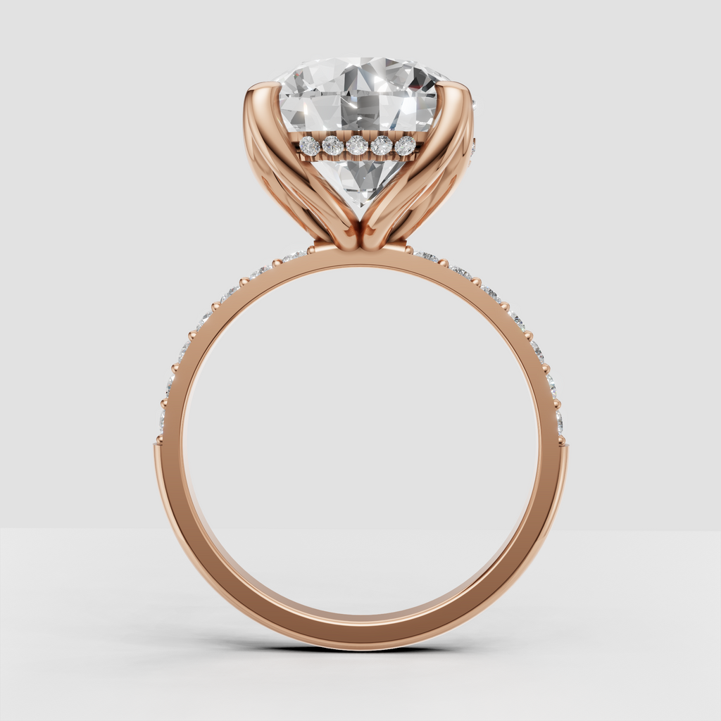 Six-prong diamond setting with pavé-style side stones