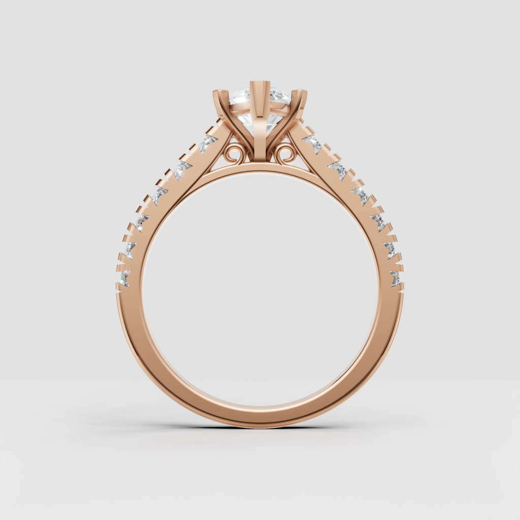 Elegant marquise diamond engagement ring in yellow gold with pavé-style shoulders