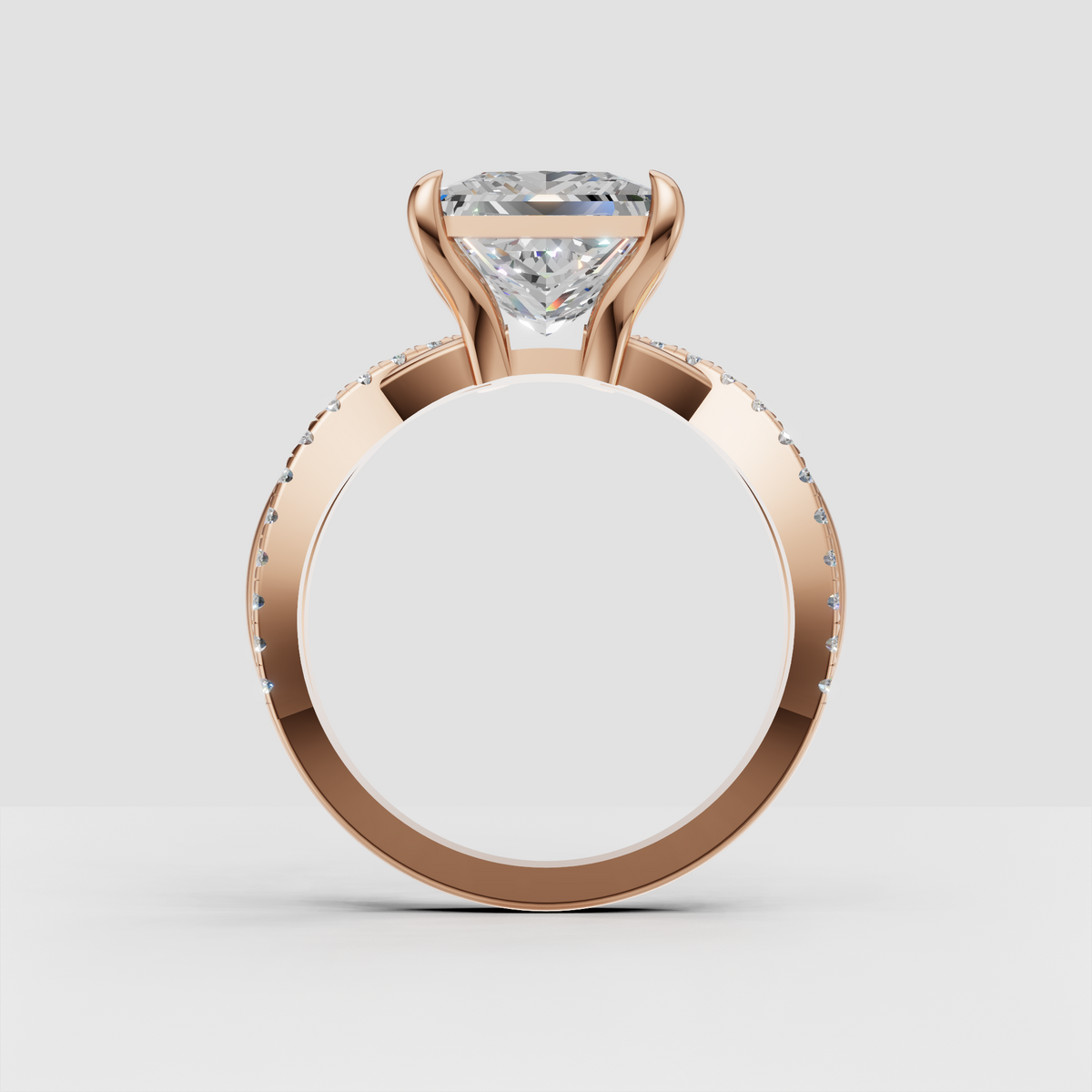 Princess diamond ring with four corner prongs and crossover band
