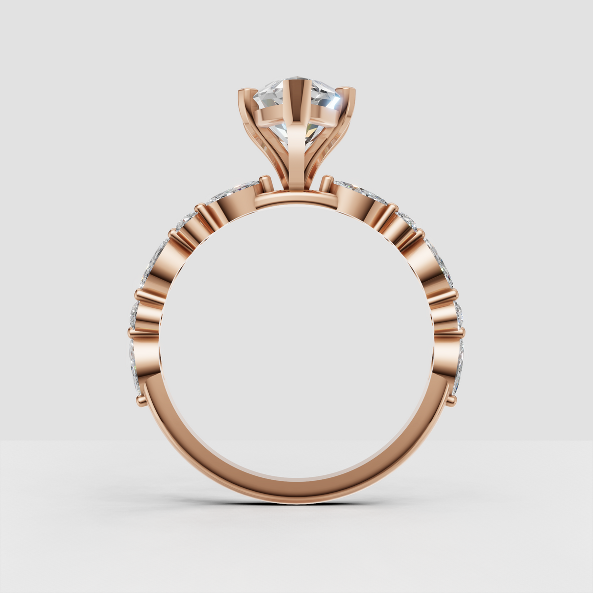 Contemporary marquise solitaire ring with round and marquise diamond shoulders.