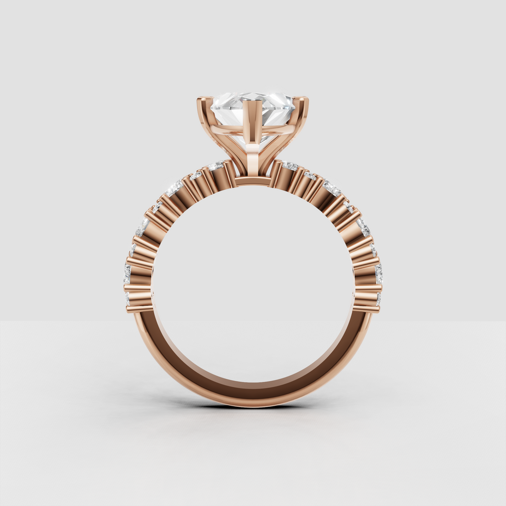 Marquise diamond engagement ring with decorative gold bead detailing