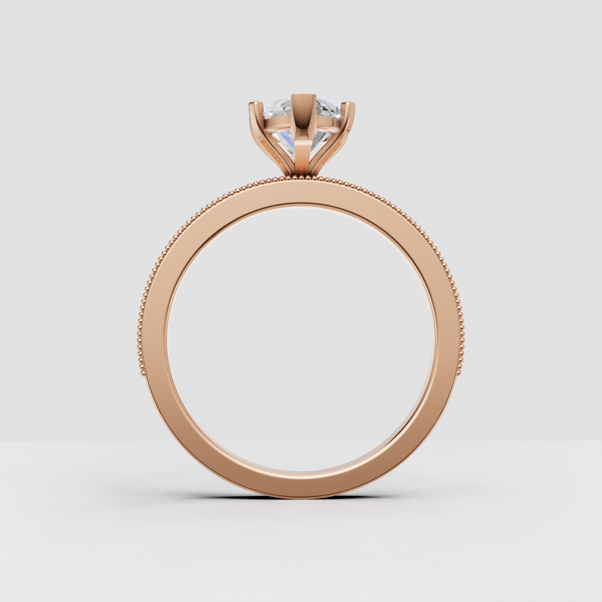 Delicate yellow gold marquise engagement ring with pavé shoulders