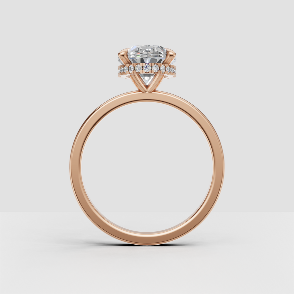 Side view of oval diamond ring with hidden halo