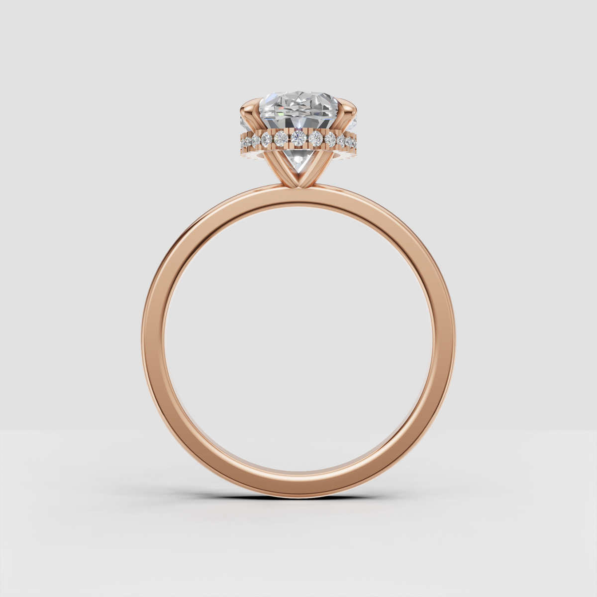 Side view of oval diamond ring with hidden halo