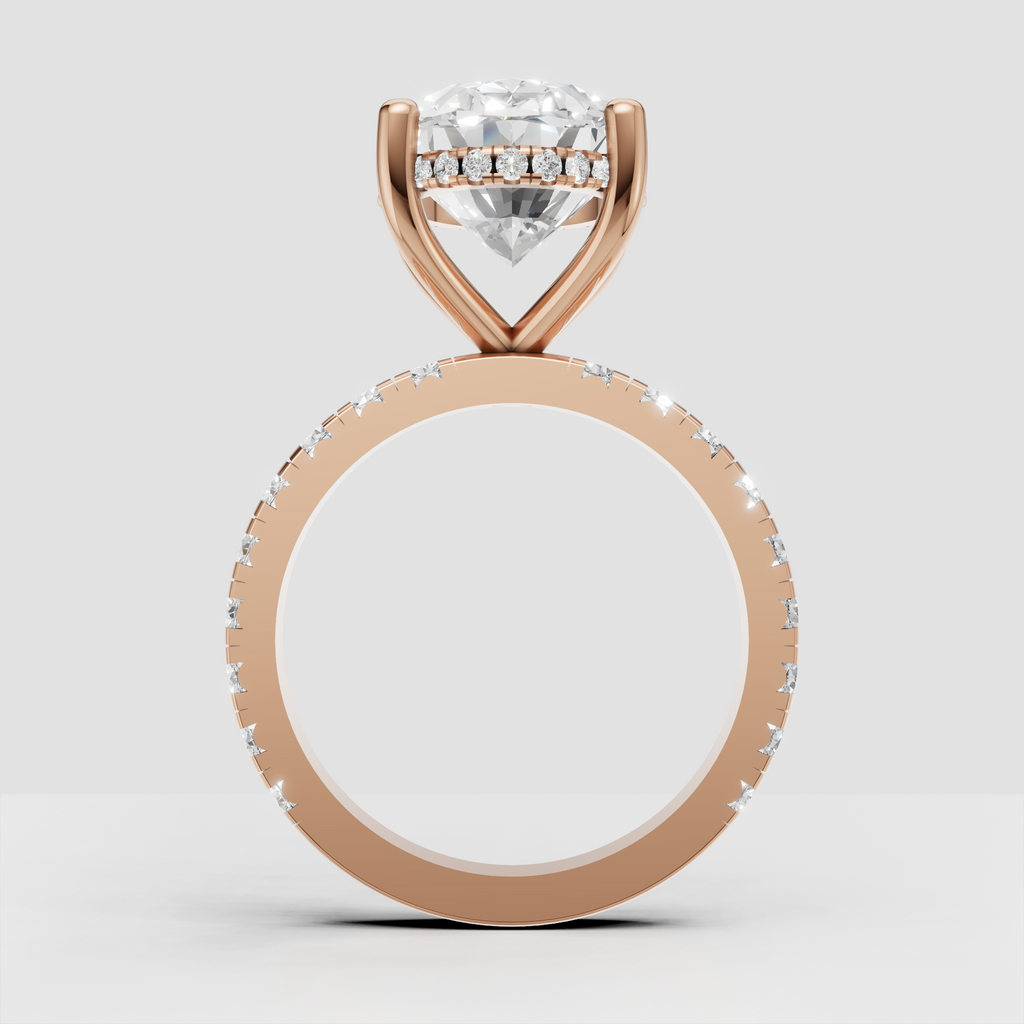 Polished gold oval engagement ring with diamond-accented band