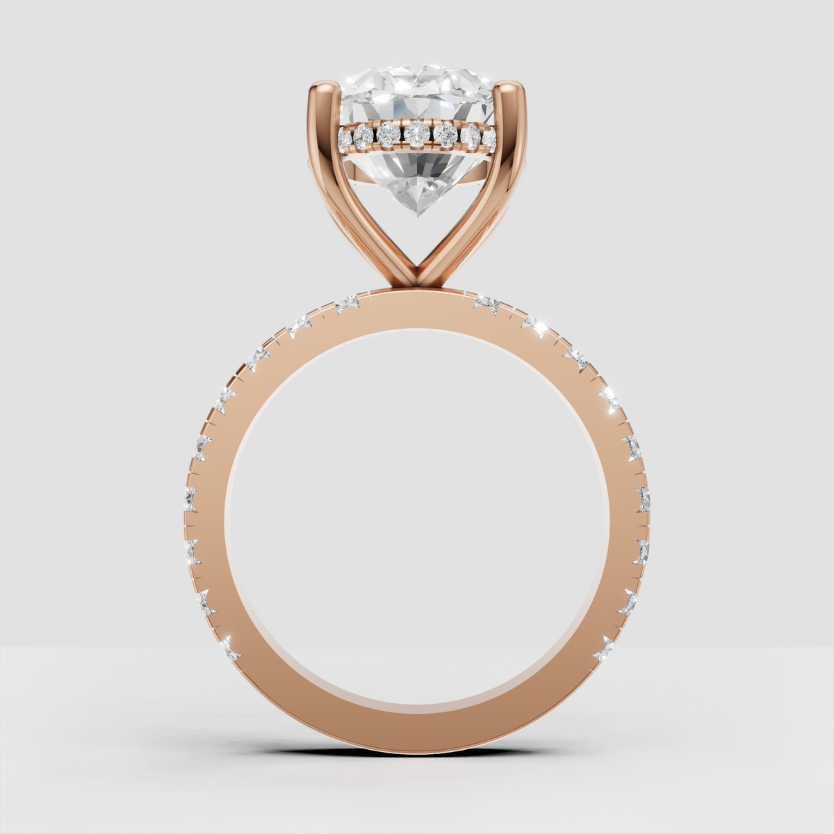 Polished gold oval engagement ring with diamond-accented band