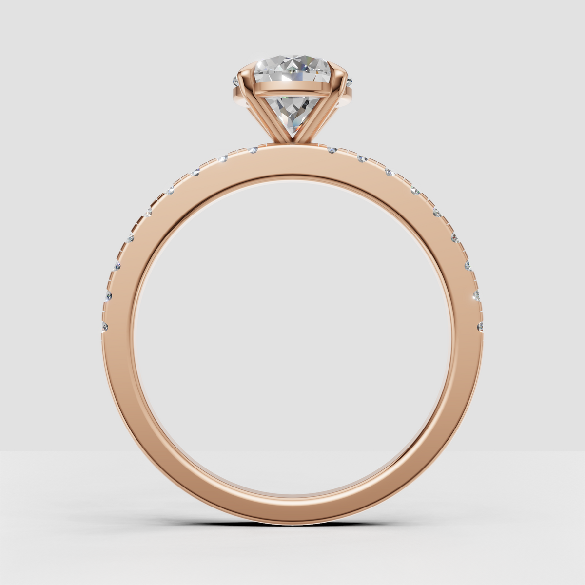 Round brilliant Diamond ring with elegant four-prong basket setting and pavé band