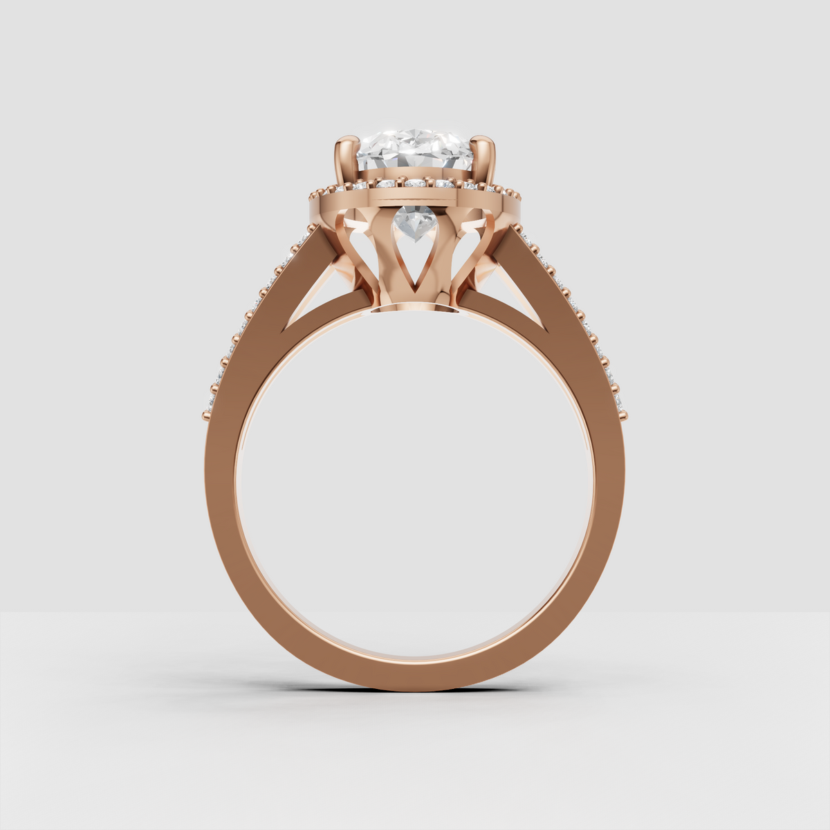 Elegant yellow gold engagement ring with elongated oval center stone.