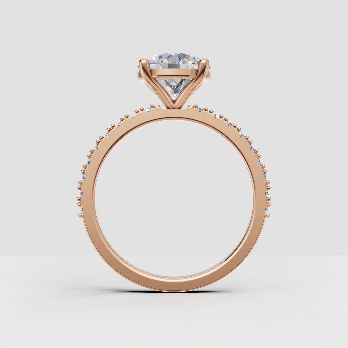 Yellow gold pave oval diamond ring with milgrain shoulders