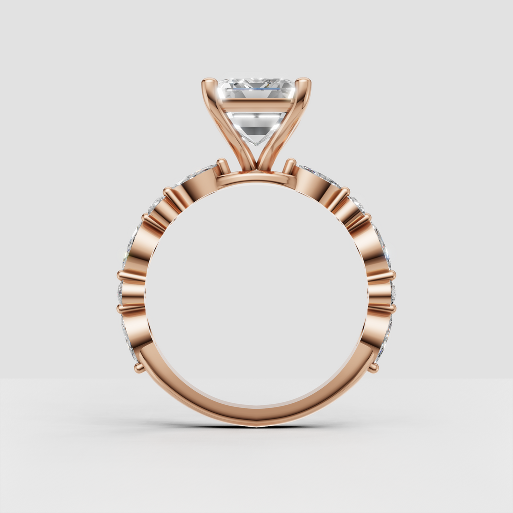 Side view of yellow gold emerald cut cathedral ring