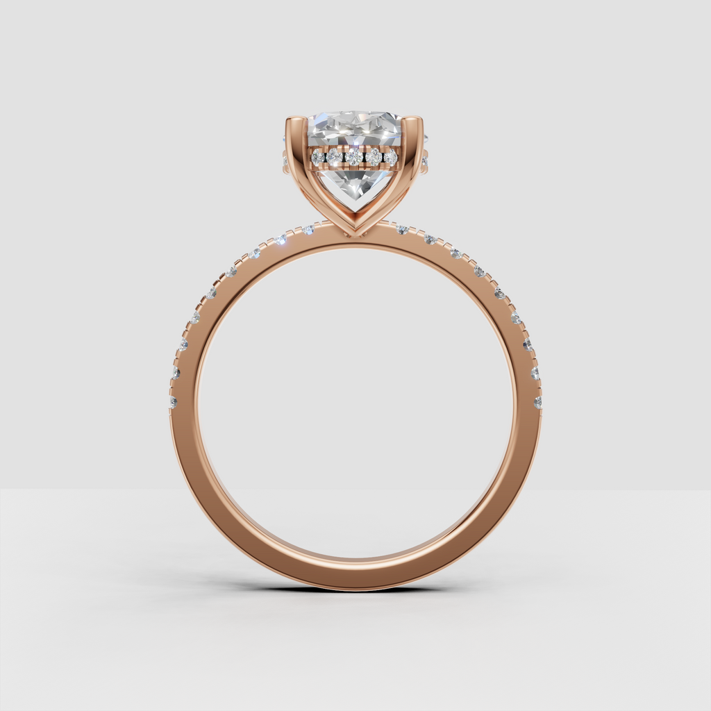 Close-up of oval diamond hidden halo engagement ring