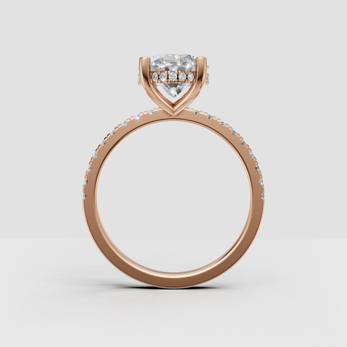 Close-up of oval diamond hidden halo engagement ring
