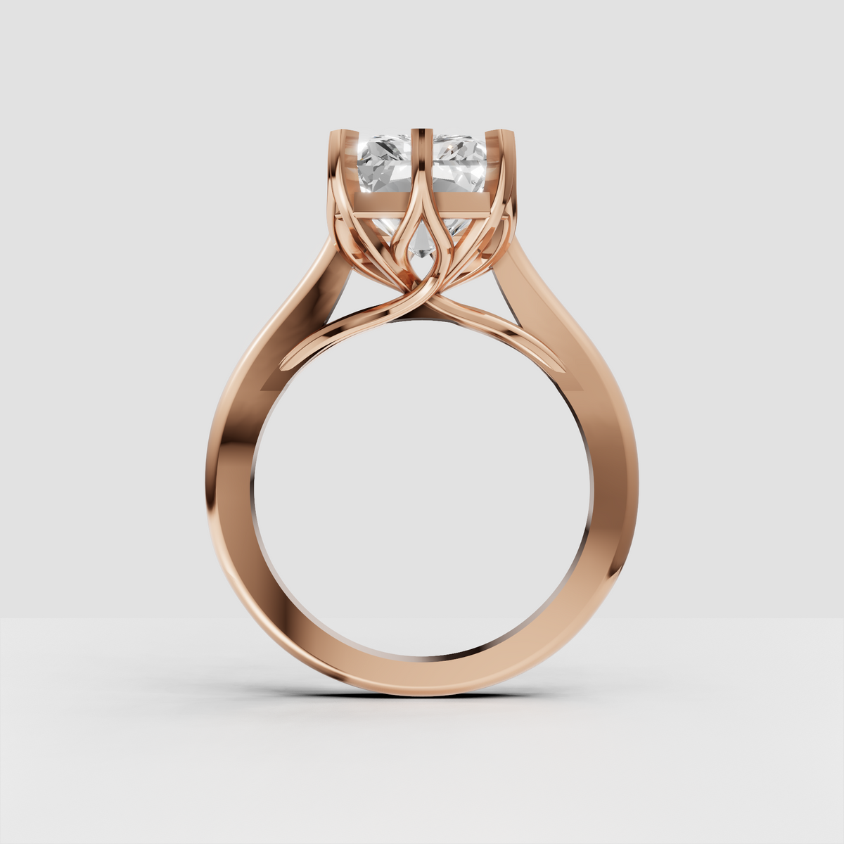 Radiant rectangular center stone in a polished yellow gold prong setting