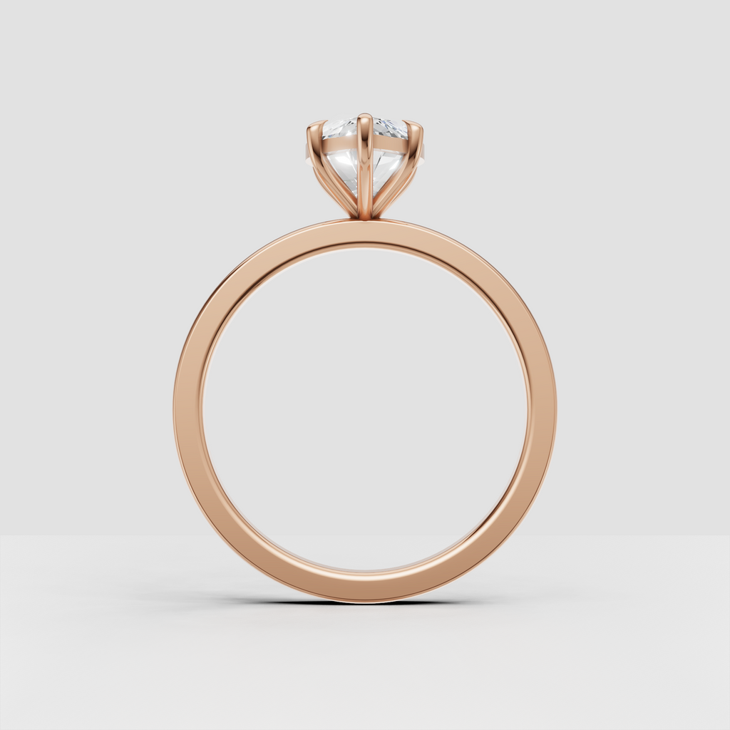 Marquise diamond bridal ring featuring a smooth yellow gold shank