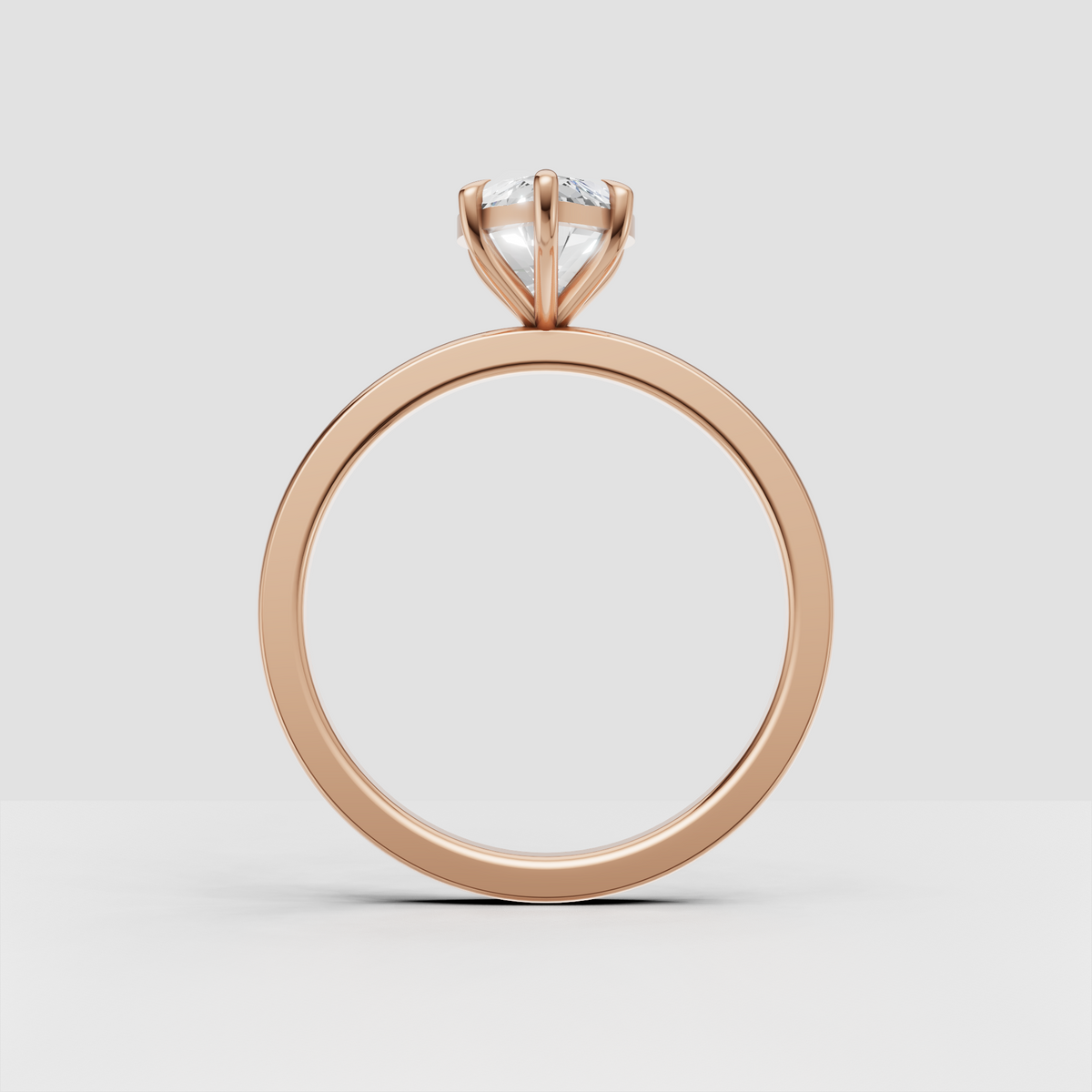 Marquise diamond bridal ring featuring a smooth yellow gold shank