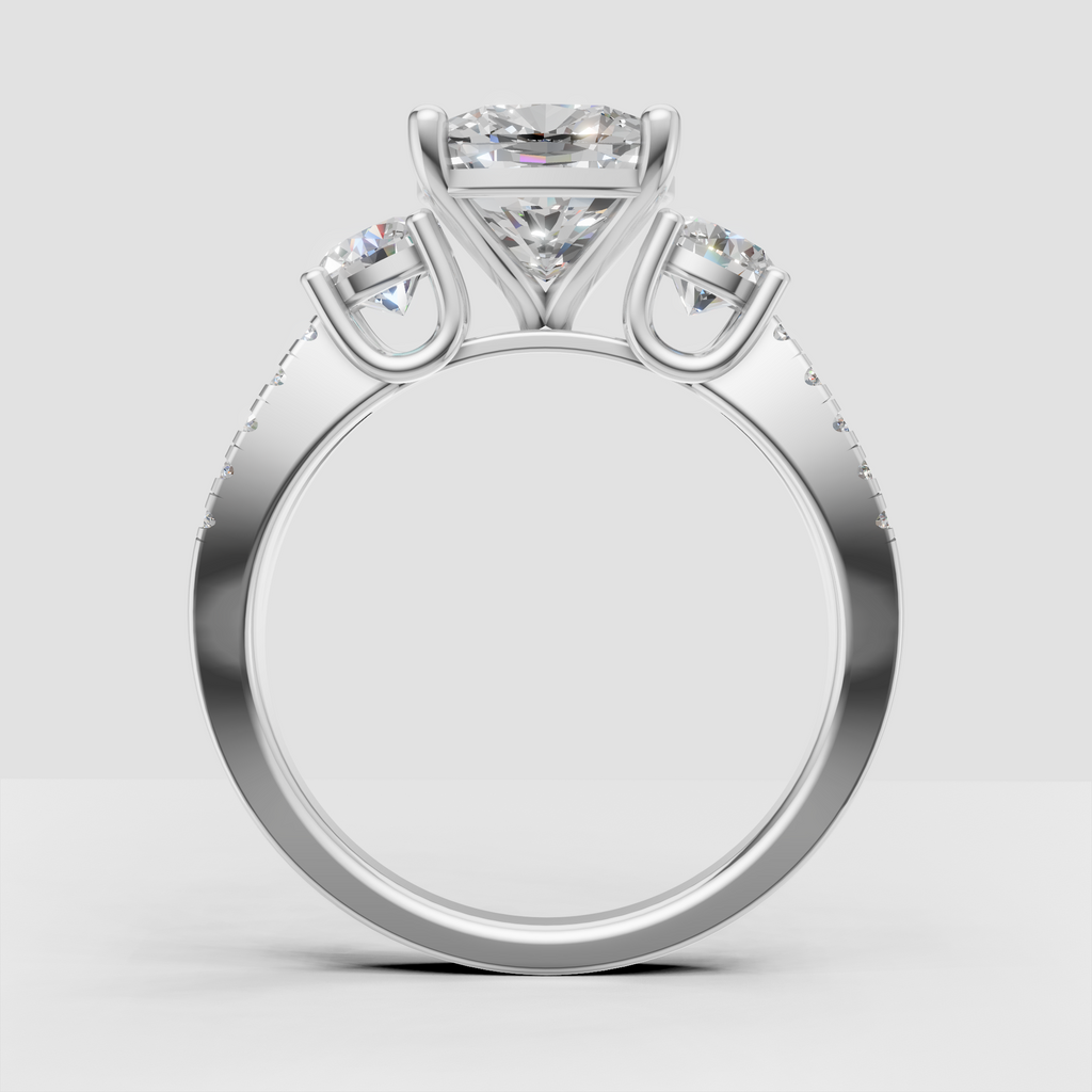 Three stone cushion cut engagement ring in yellow gold
