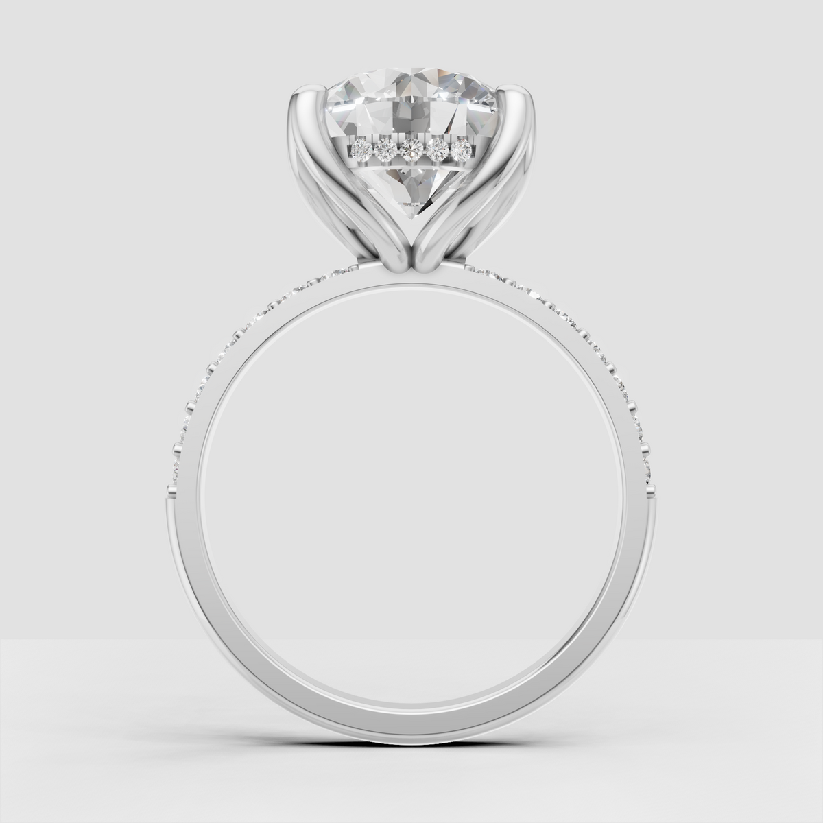 Round Diamond engagement ring featuring a raised cathedral gallery and pavé band