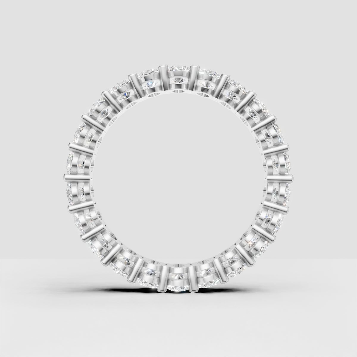 Classic oval cut diamond eternity ring in yellow gold