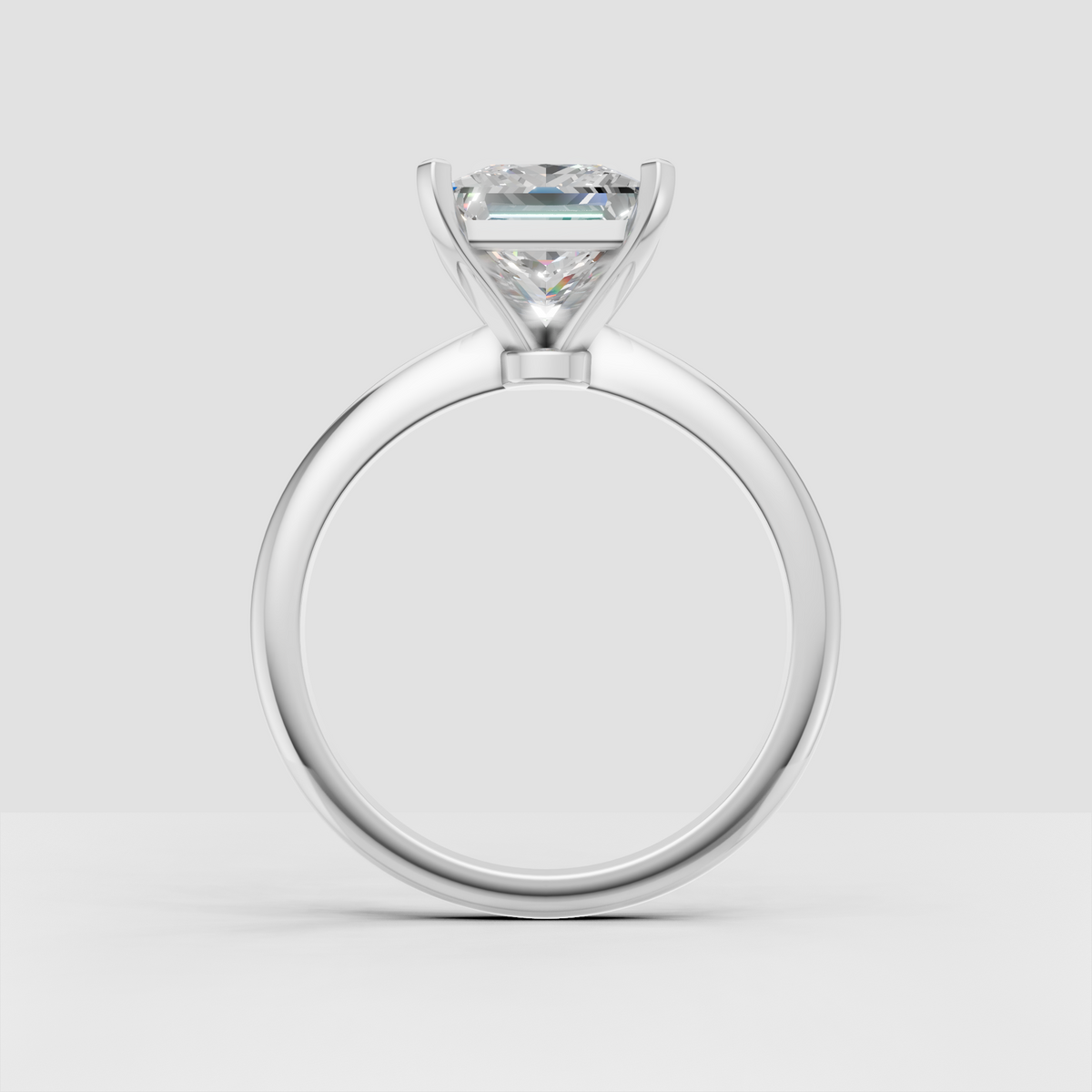 Princess cut canter diamond secured by four gold prongs