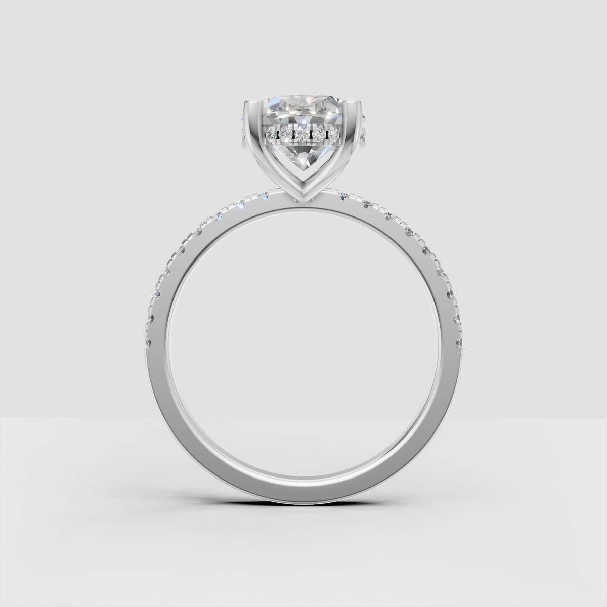 Classic oval diamond engagement ring with concealed halo