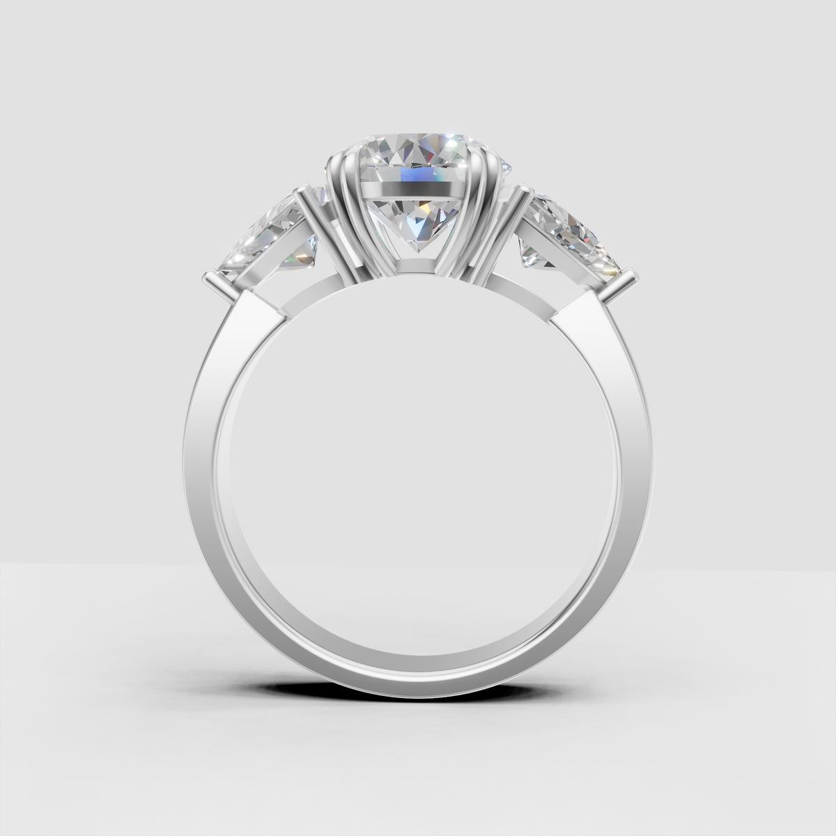 Classic three-stone diamond ring with round and Trillion cut stones