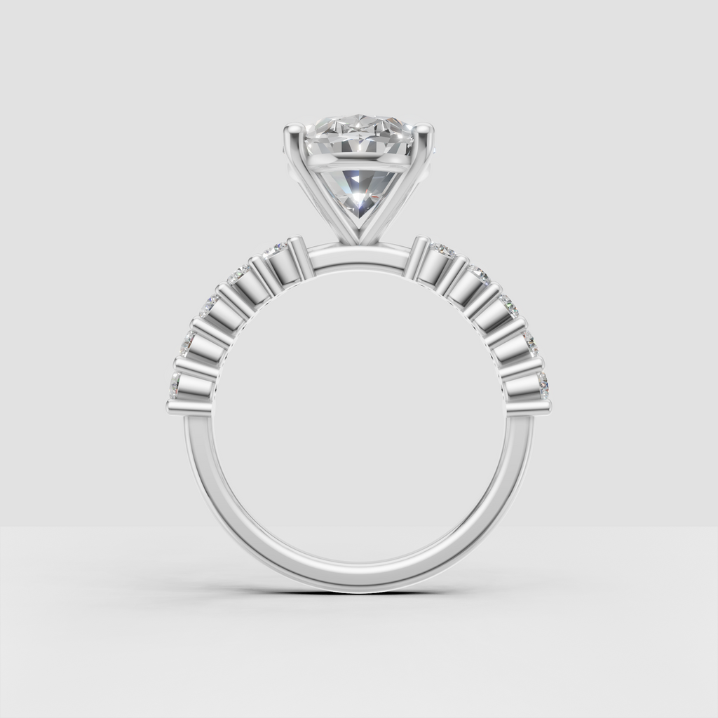 Yellow gold oval engagement ring with channel set side diamonds