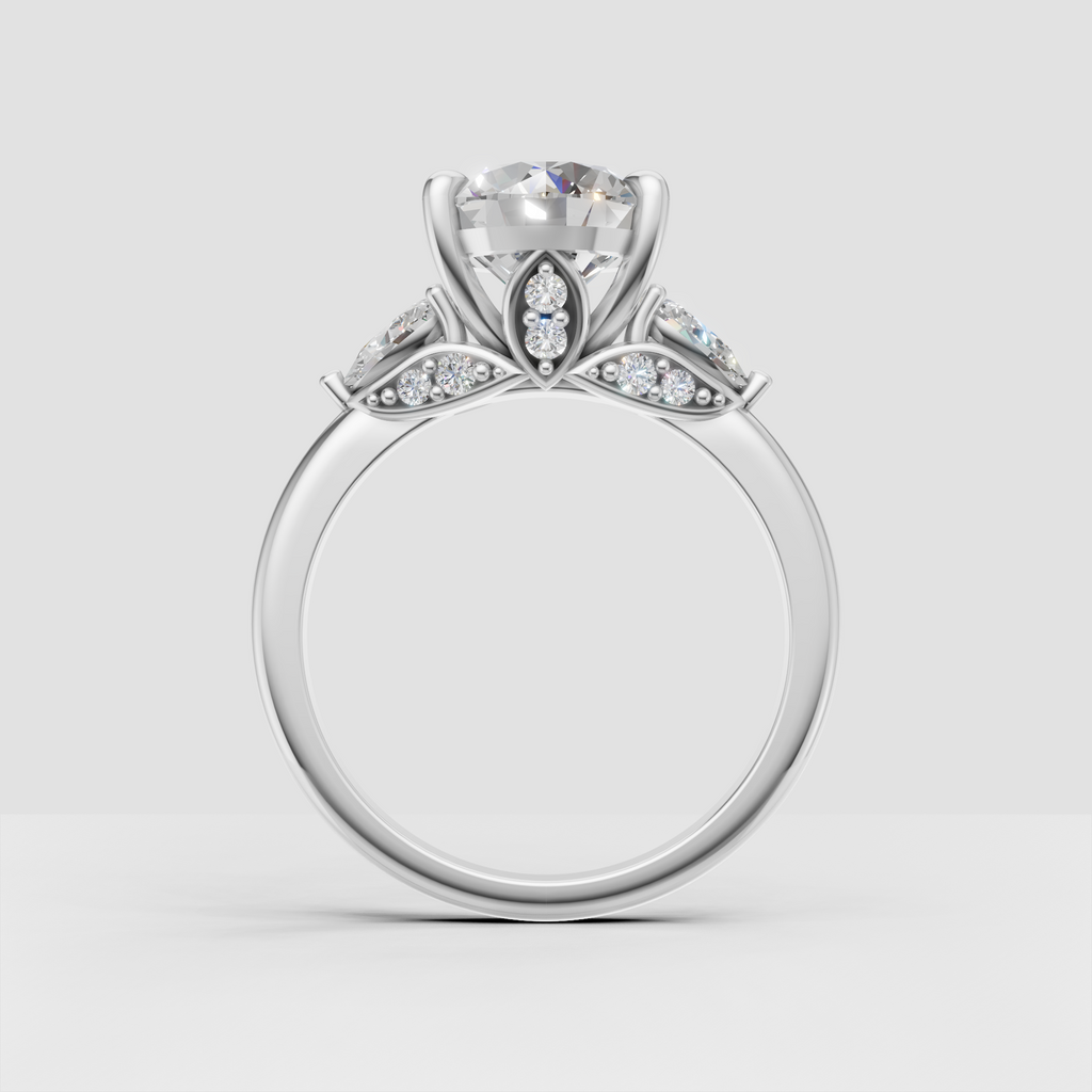 Elegant three-stone engagement ring with round center stone