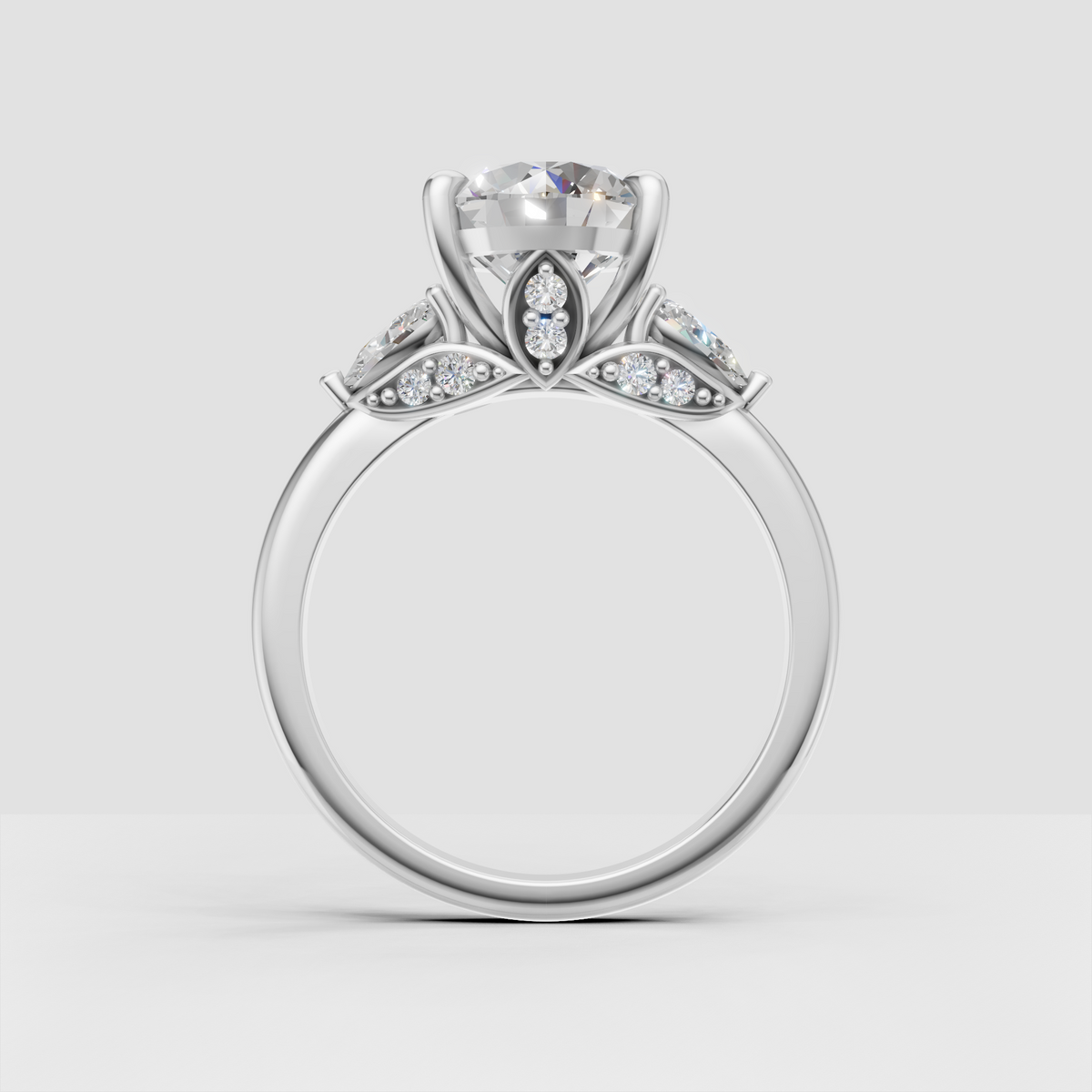 Elegant three-stone engagement ring with round center stone