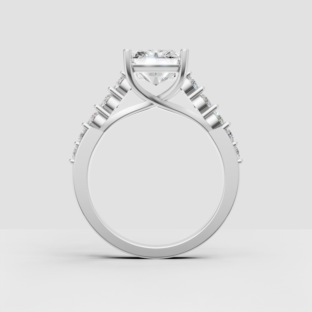 Yellow gold crossover engagement ring with elongated radiant center stone