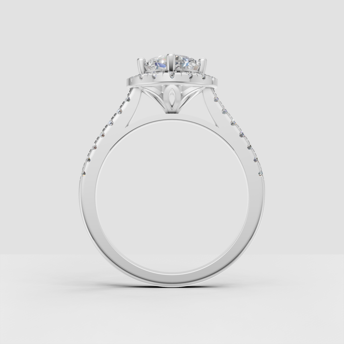Cushion cut engagement ring with cathedral profile and sparkling pavé shoulders