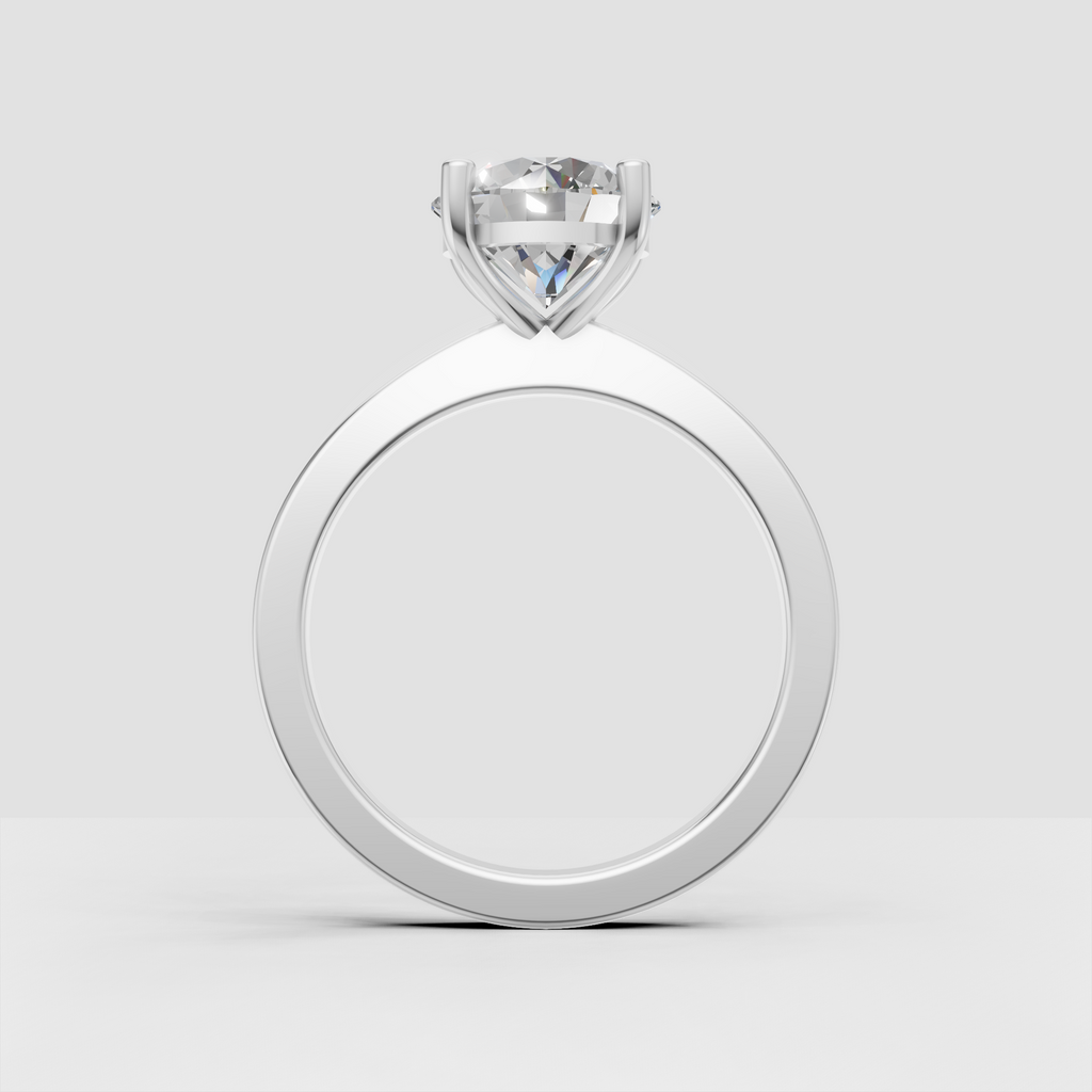 Four-prong solitaire engagement ring with round center stone