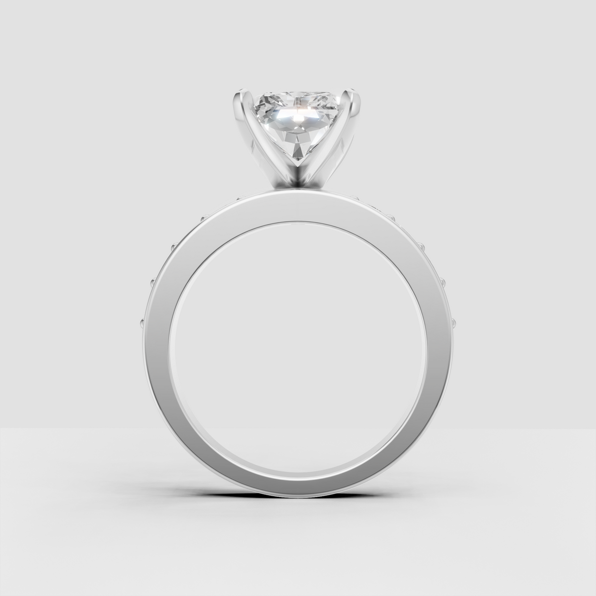 Modern radiant diamond ring with four-prong center setting