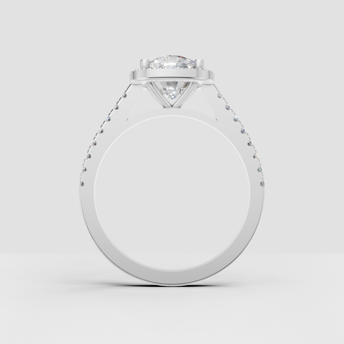 Oval diamond halo ring in polished gold