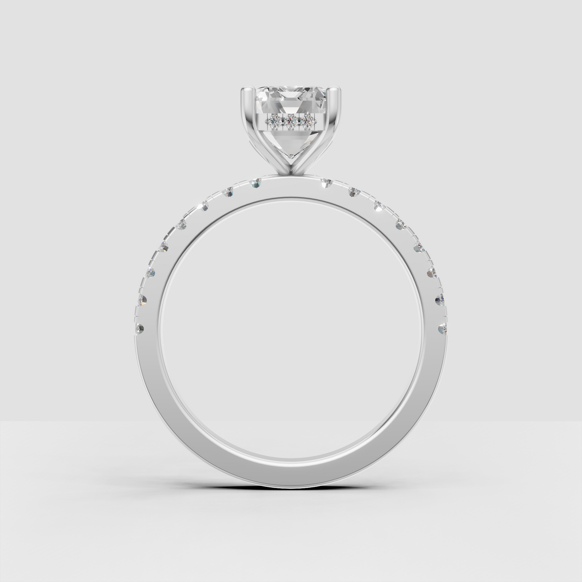 Emerald cut hidden halo ring with four prong setting