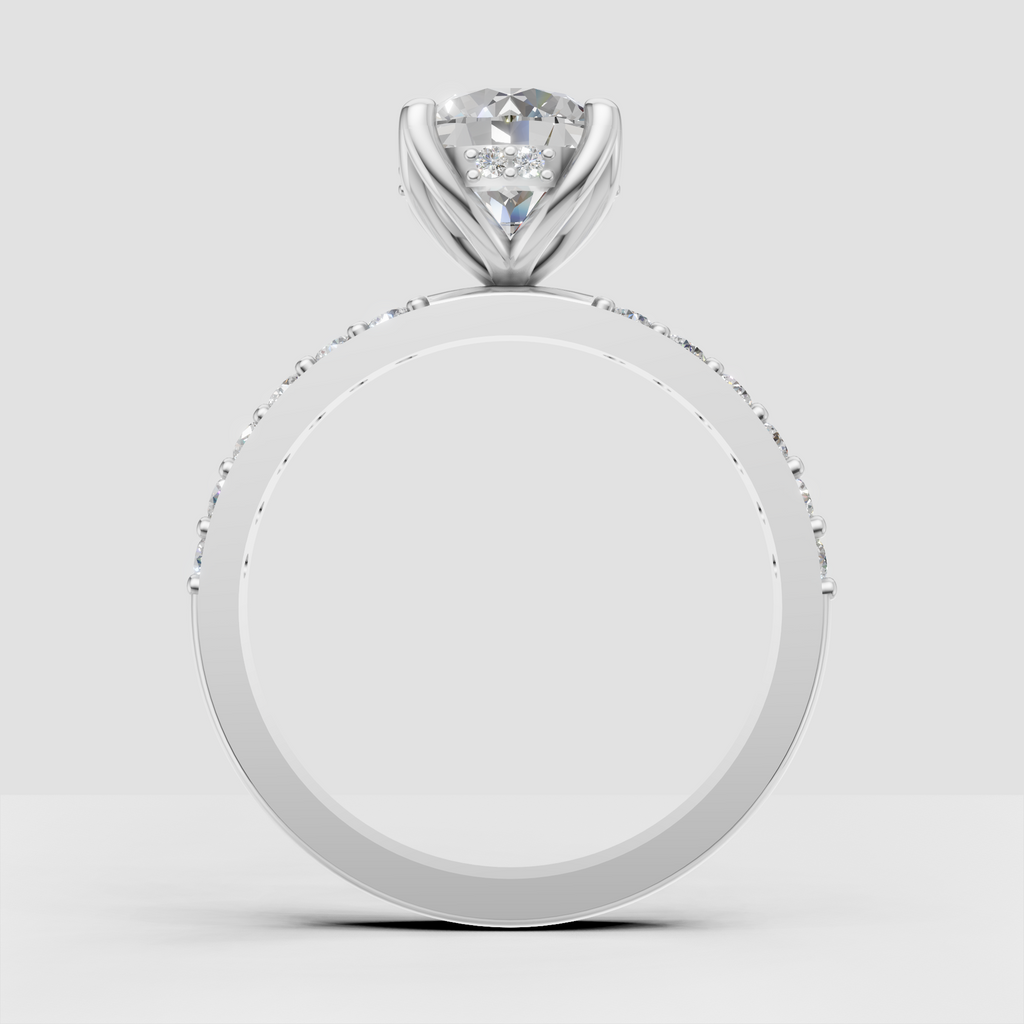 Yellow gold round diamond ring with sparkling shoulder accents
