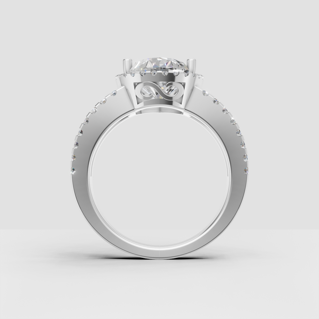 Pear cut diamond ring featuring a full round stone halo