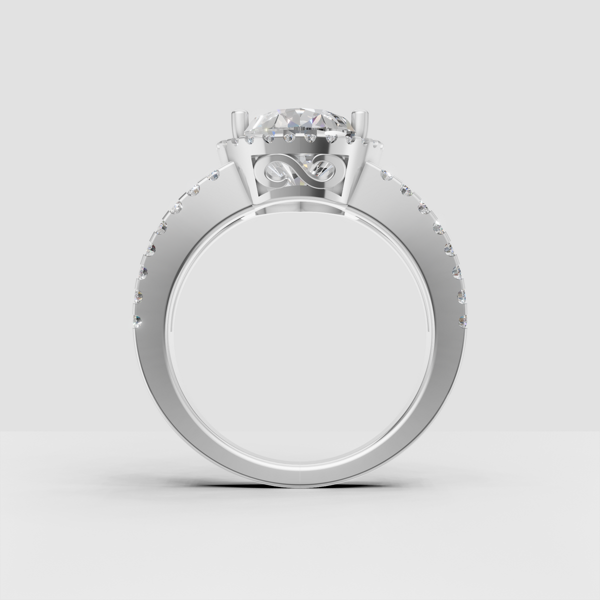 Pear cut diamond ring featuring a full round stone halo