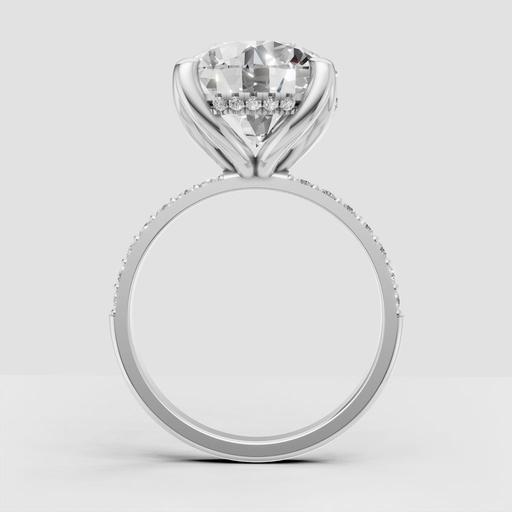 Round diamond ring featuring sculpted split-style shoulders